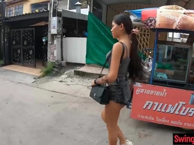 Tiny Thai teen gives a blowjob and has sex with a tall foreigner