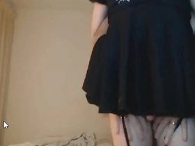 Mature man and submissive crossdresser engage in sexual activity