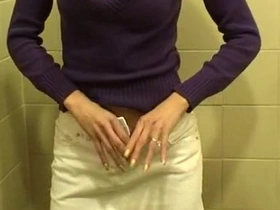 Two girls engage in oral sex in a public restroom