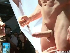 A seductive nurse performs oral sex on stage in front of an eager audience