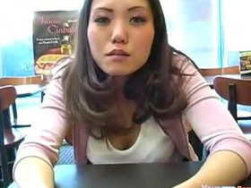 Asian beauty exposes her large breasts in public
